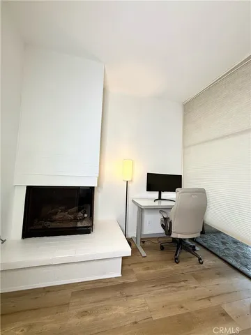 a bathroom with a double vanity sink a toilet a mirror and shower