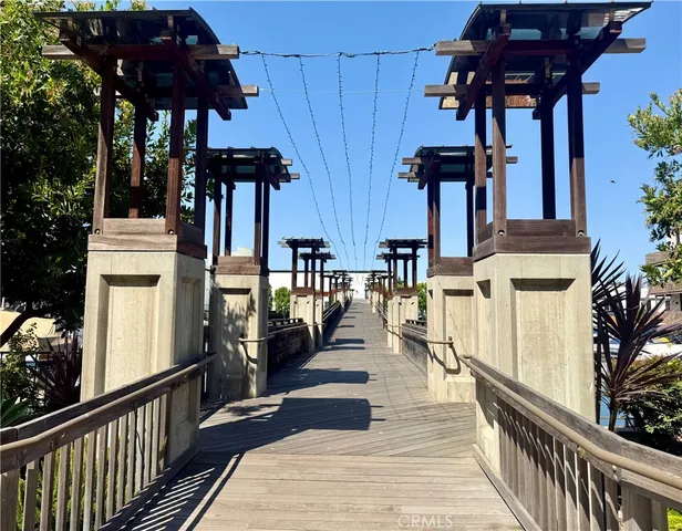 a swimming pool with outdoor seating and yard
