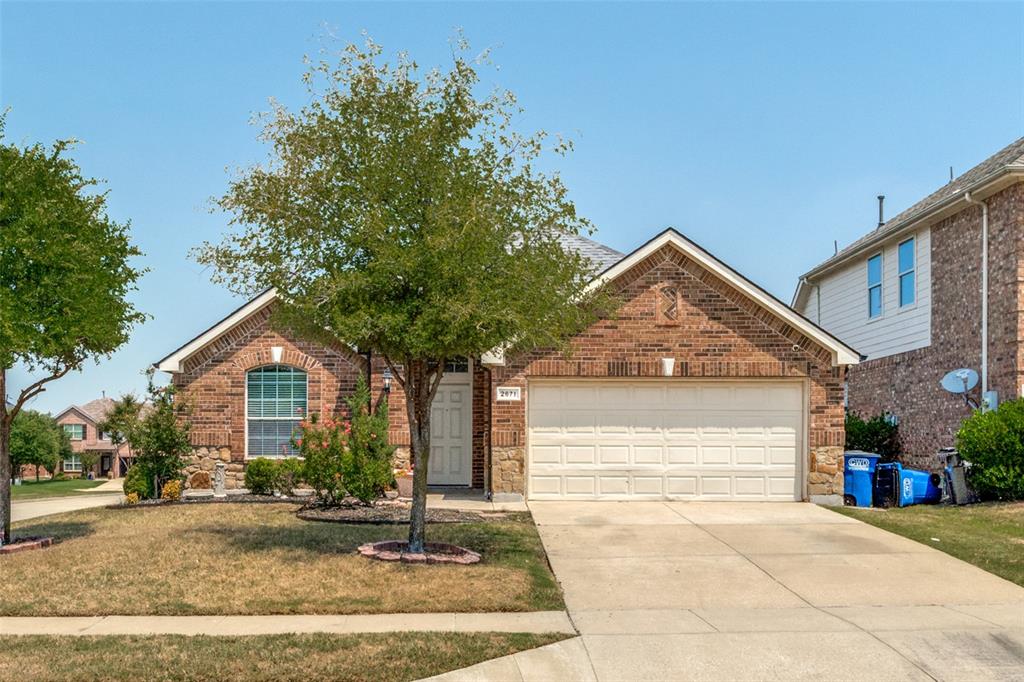 2671 Lake Ridge Drive Little Elm, TX 75068 - Photo 1 of 1 a front view of a house with yard and garage