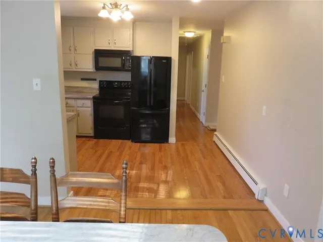 a view of a kitchen from the hallway