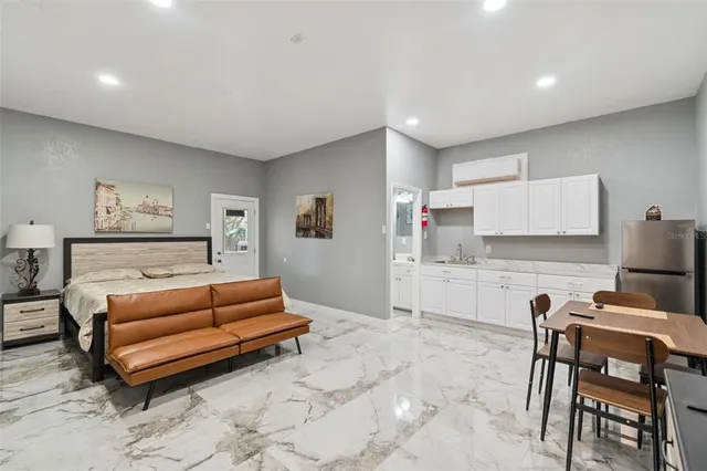 a bedroom with furniture and a table