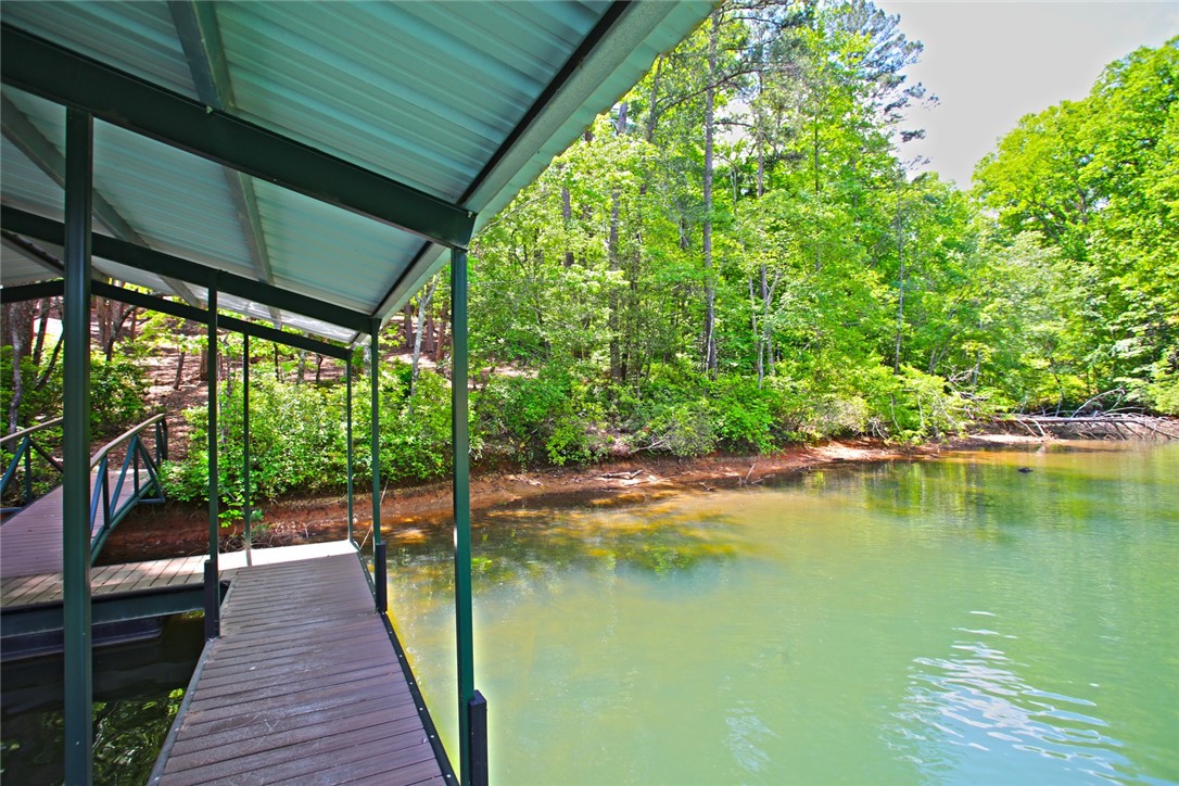 Lot 114 Harbor Point Seneca, SC 29672 - Photo 26 of 46 This serene lakefront property offers direct water access and lush natural surroundings.