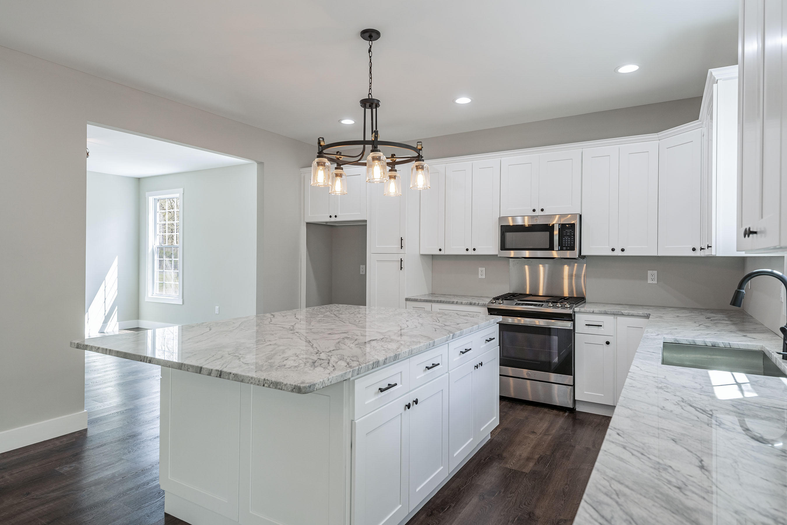 331 East Pleasant Grove Road Jackson, NJ 08527 - Photo 13 of 40 a kitchen with stainless steel appliances granite countertop a sink stove and refrigerator