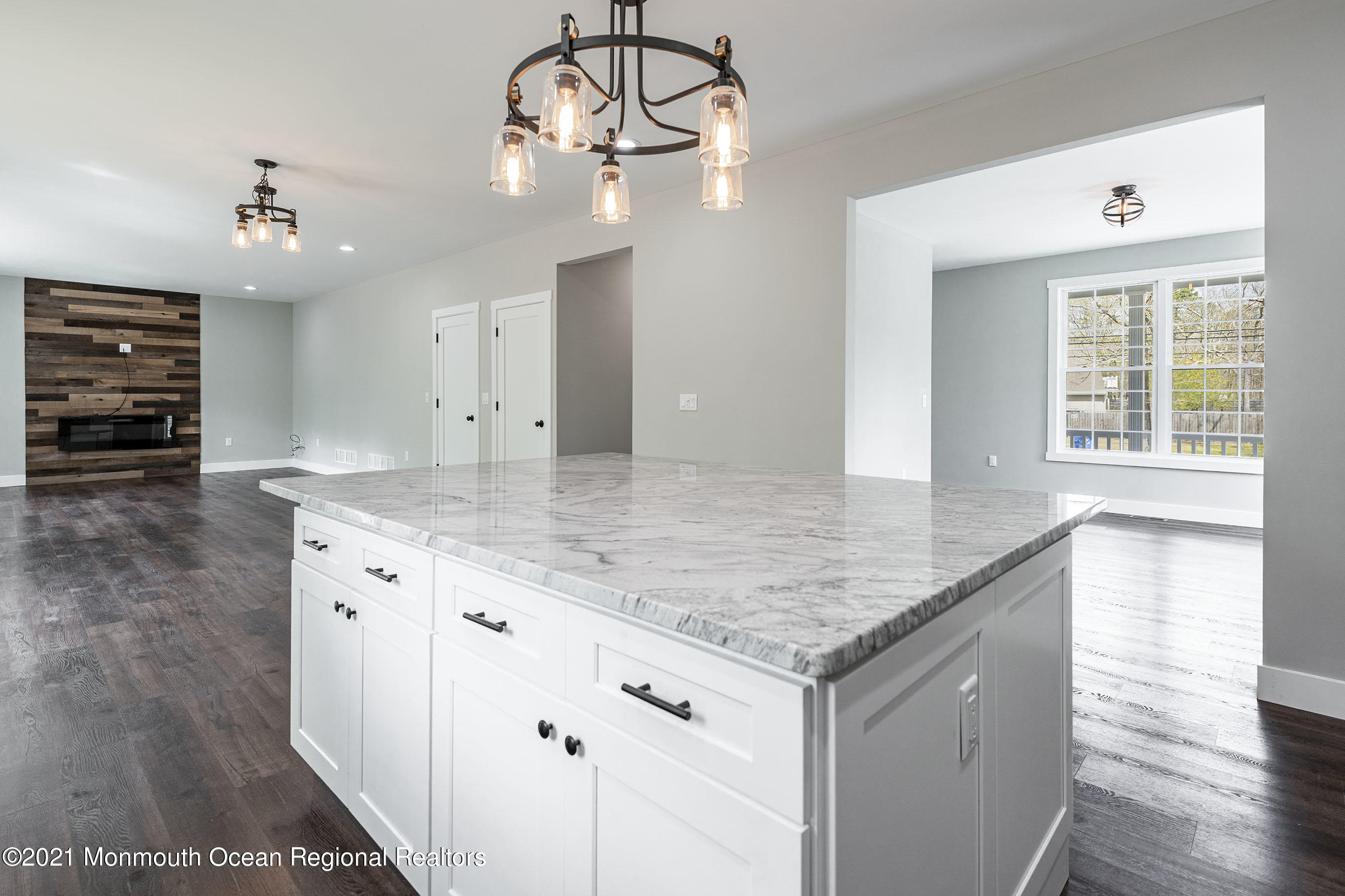 331 East Pleasant Grove Road Jackson, NJ 08527 - Photo 14 of 40 a kitchen with center island table and chairs