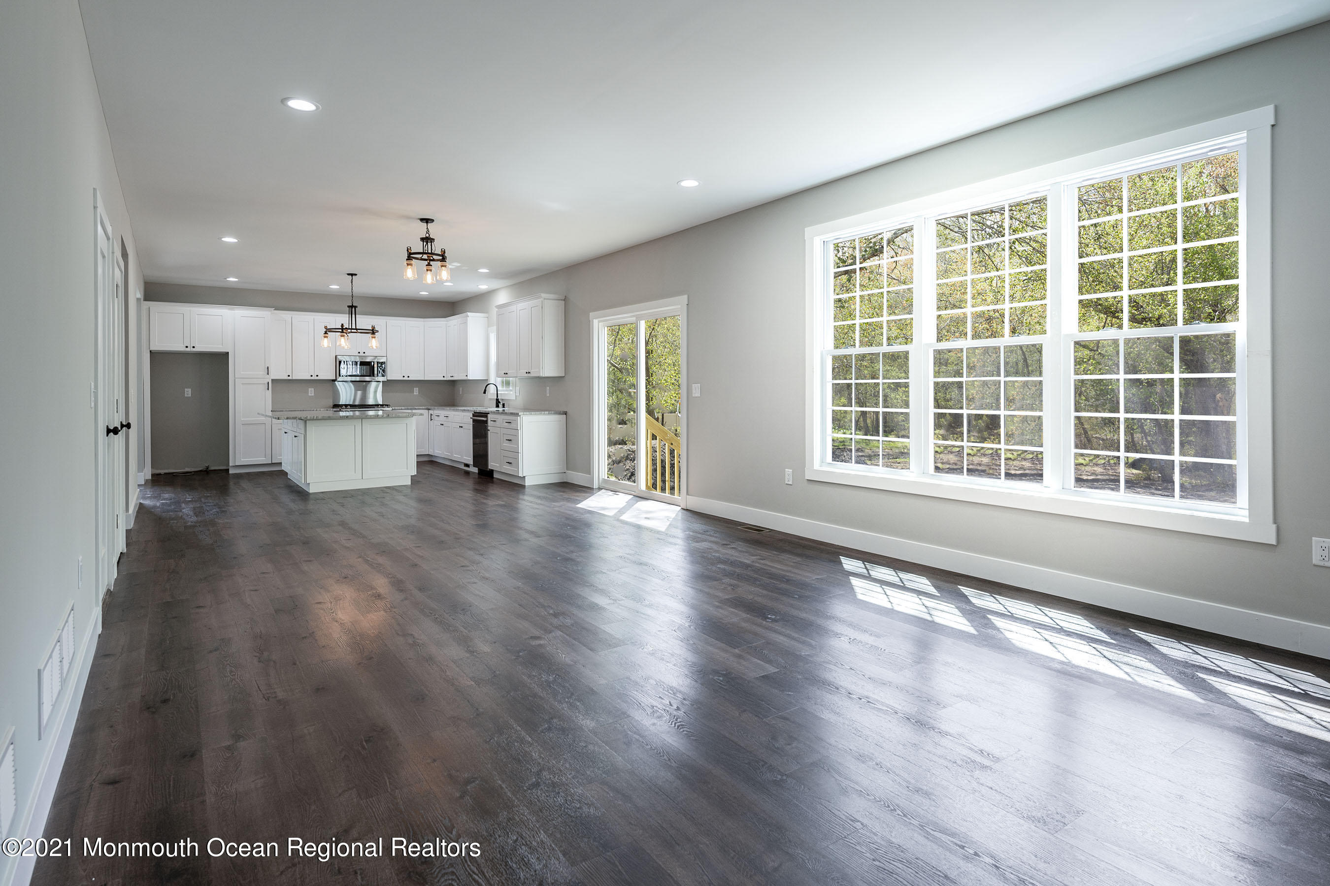 331 East Pleasant Grove Road Jackson, NJ 08527 - Photo 18 of 40 a view of an empty room with a window and wooden floor