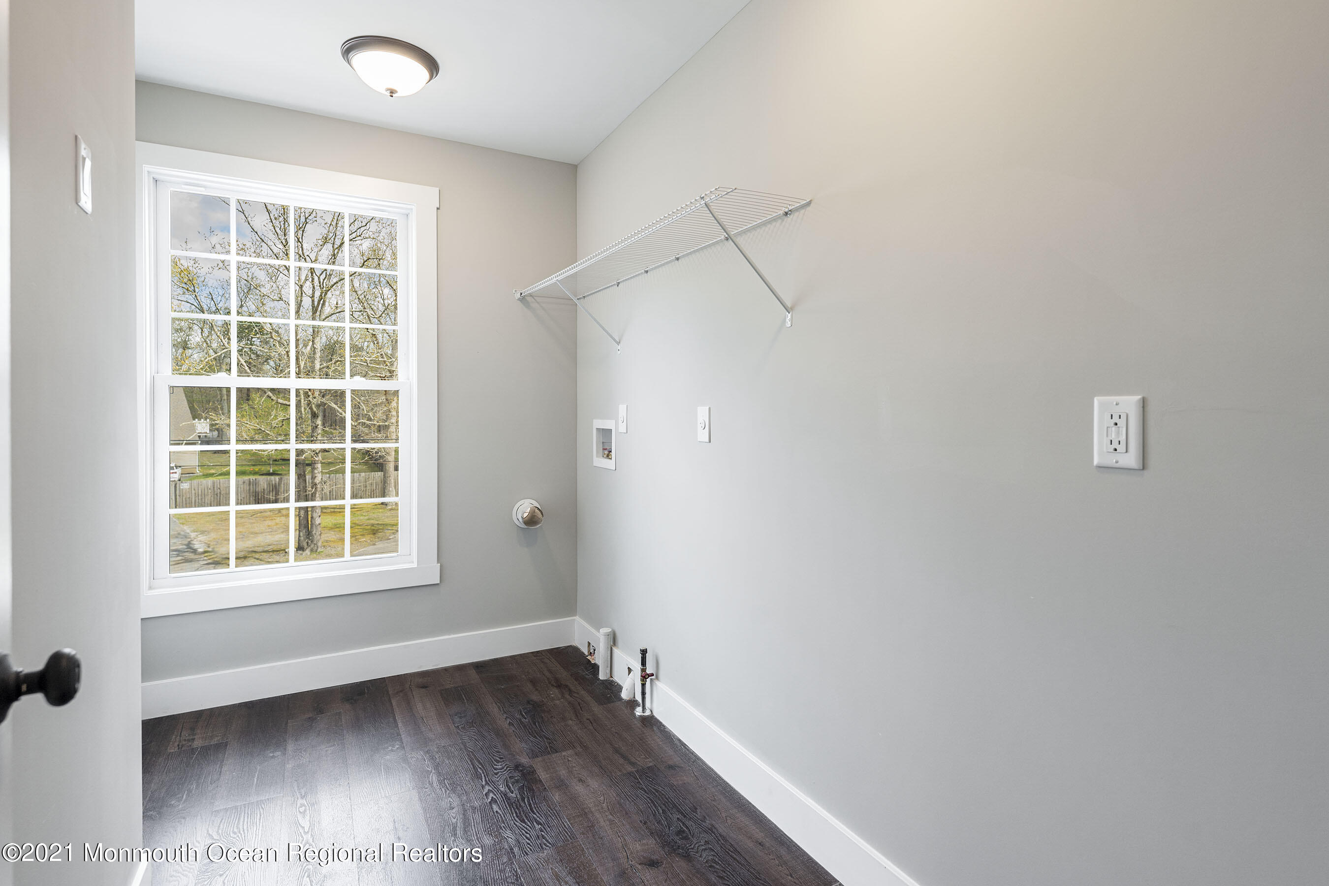 331 East Pleasant Grove Road Jackson, NJ 08527 - Photo 22 of 40 an empty room with wooden floor and windows