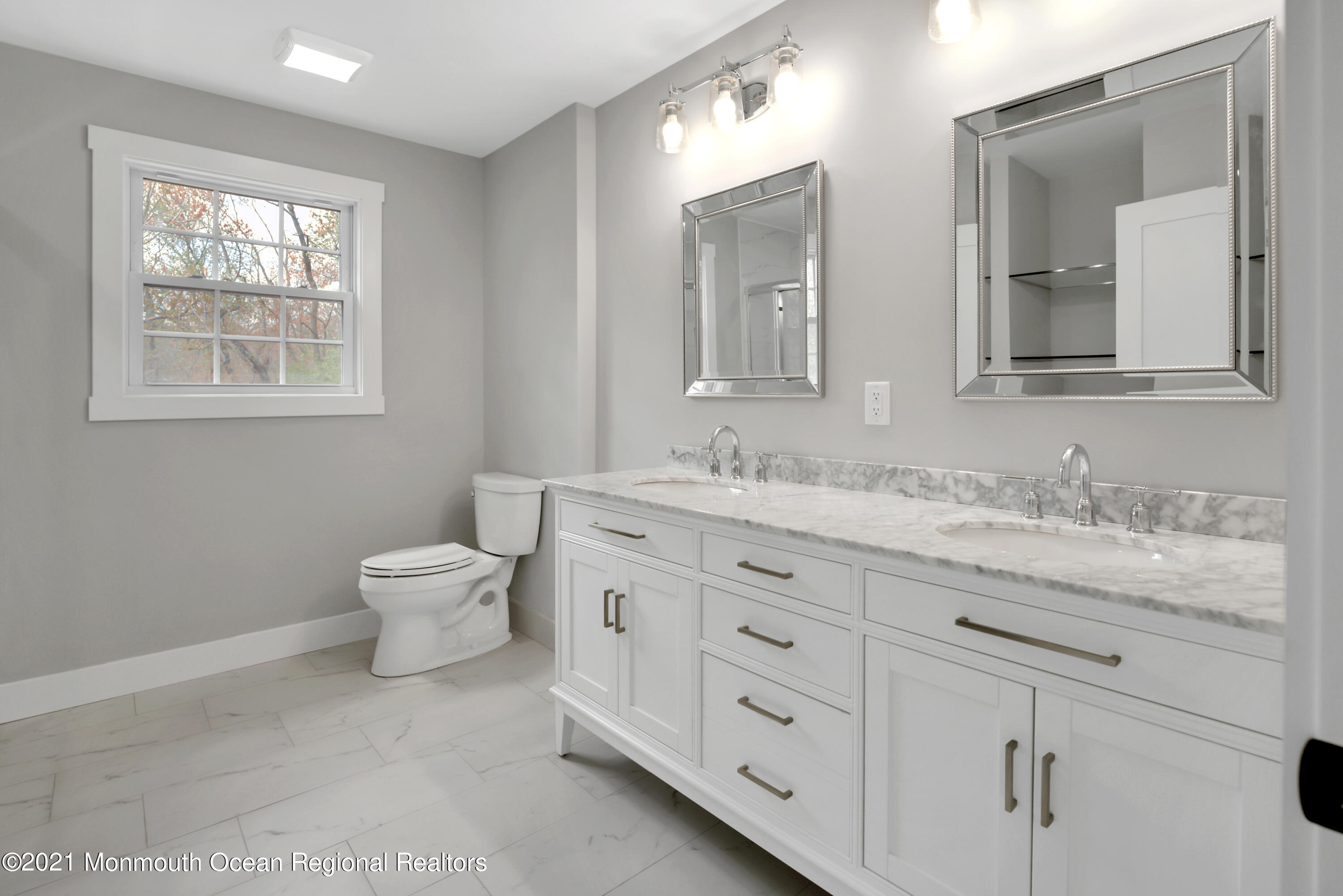 331 East Pleasant Grove Road Jackson, NJ 08527 - Photo 26 of 40 a bathroom with double sink and a mirror