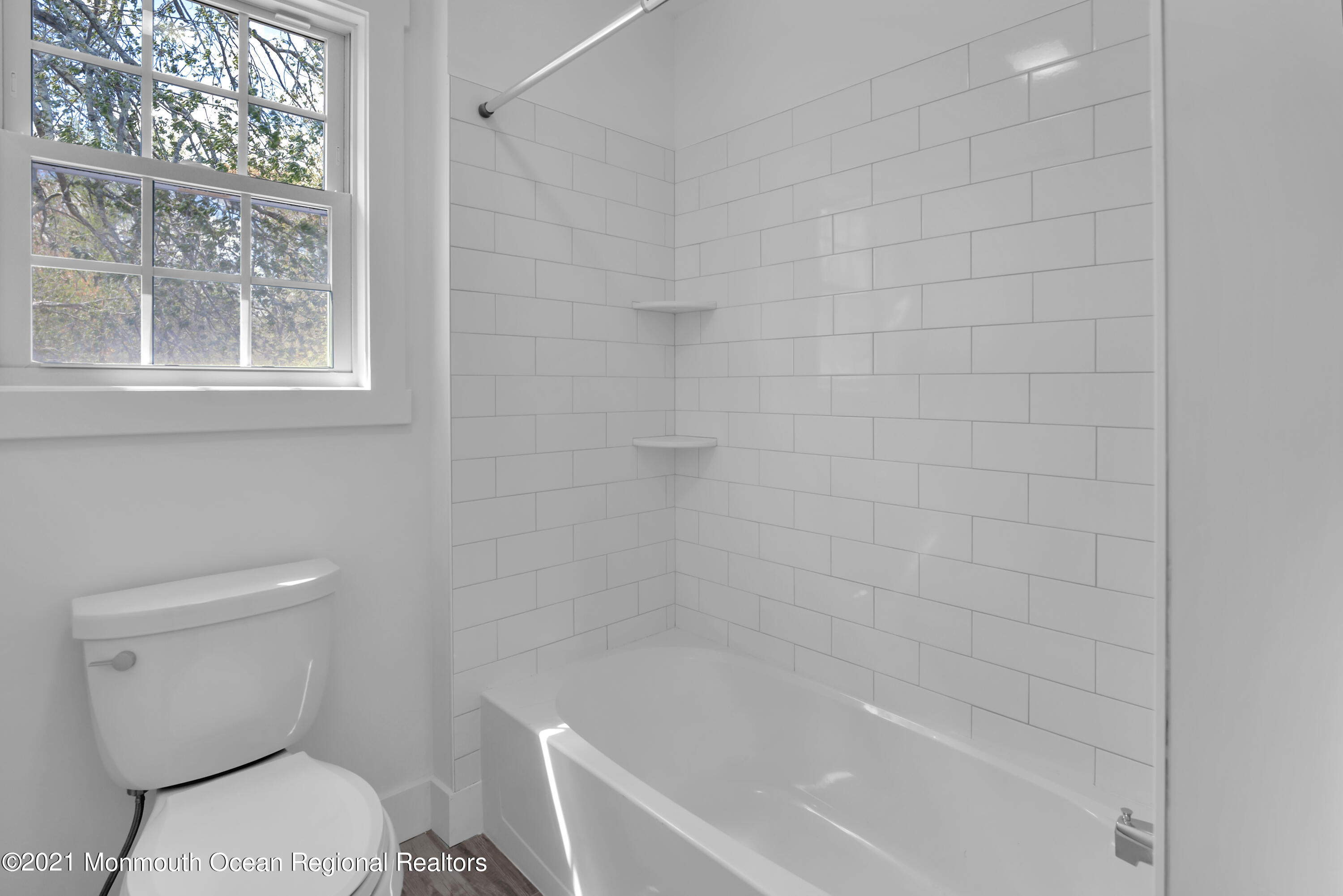 331 East Pleasant Grove Road Jackson, NJ 08527 - Photo 33 of 40 a white toilet sitting next to a bath tub shower