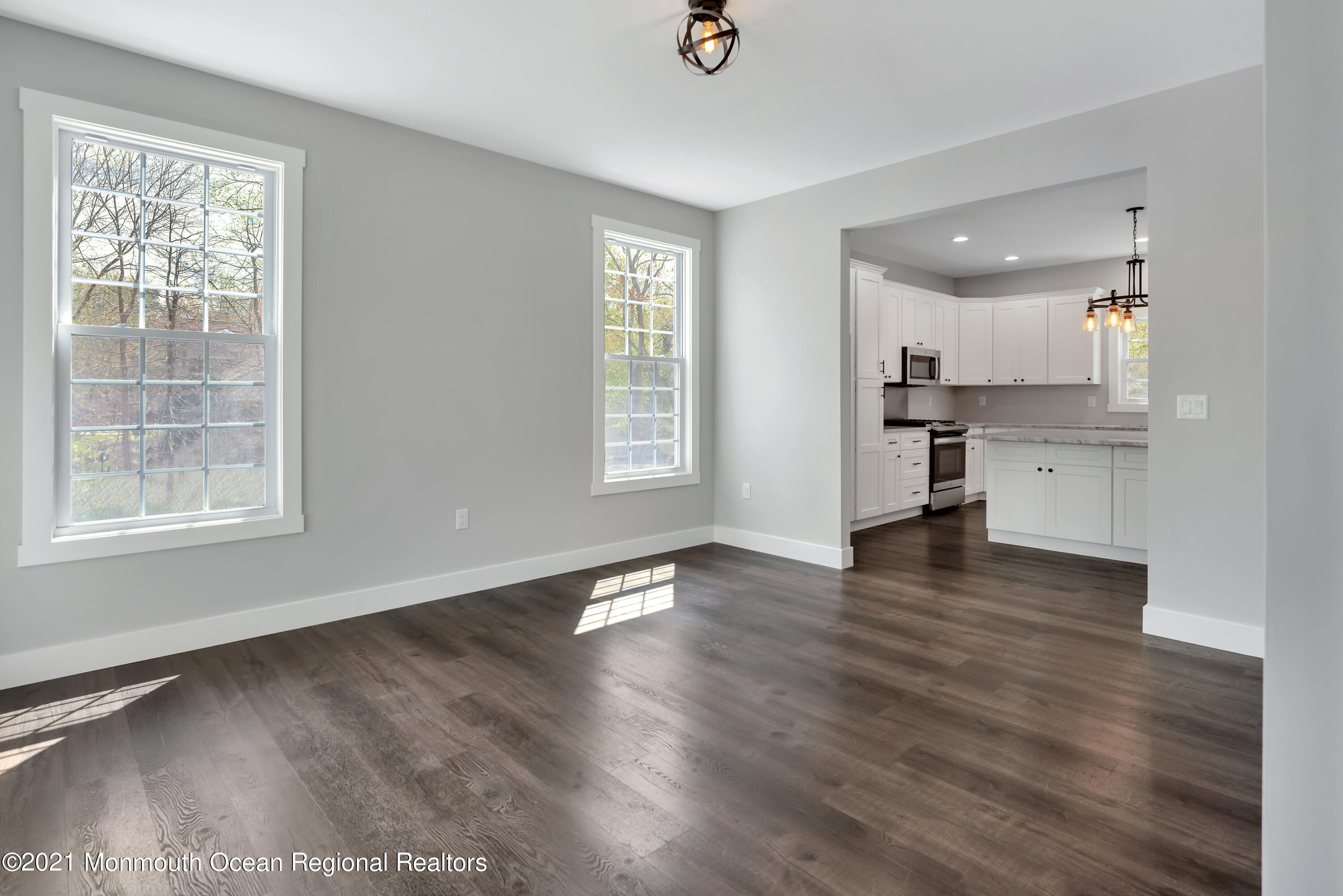 331 East Pleasant Grove Road Jackson, NJ 08527 - Photo 7 of 40 a view of an empty room with a window and wooden floor