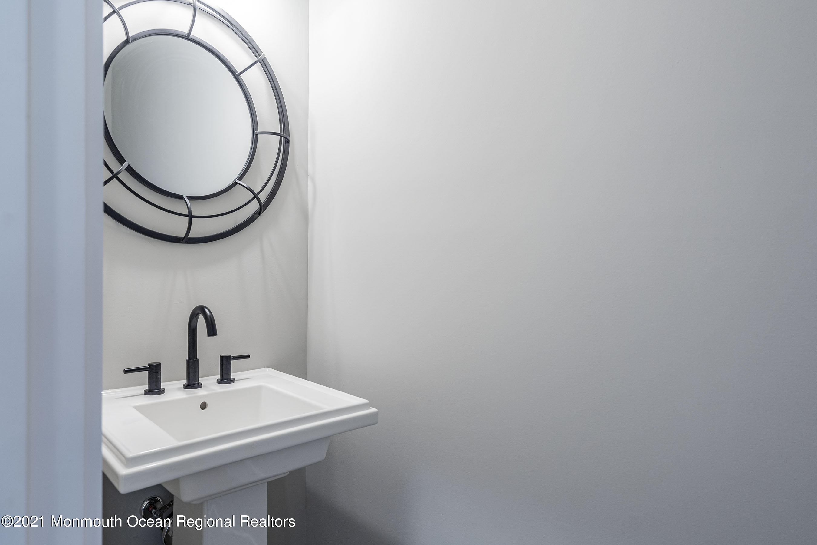 331 East Pleasant Grove Road Jackson, NJ 08527 - Photo 9 of 40 a bathroom with a sink and a mirror
