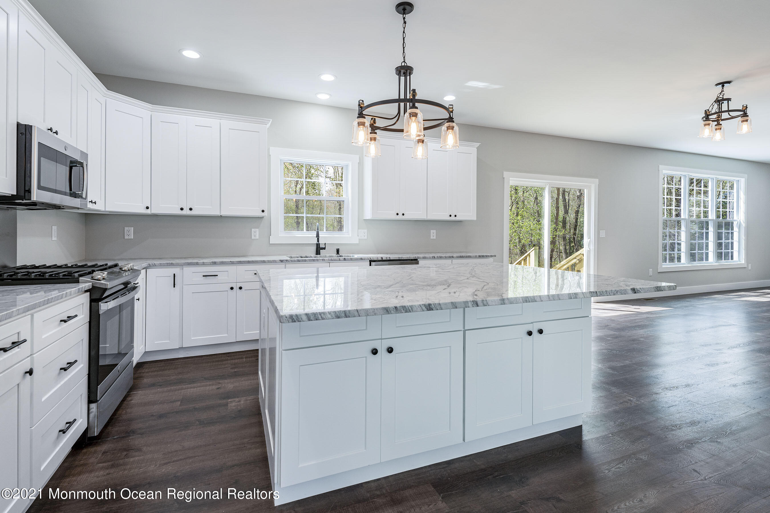 331 East Pleasant Grove Road Jackson, NJ 08527 - Photo 10 of 40 a kitchen with granite countertop white cabinets white appliances a sink and a window