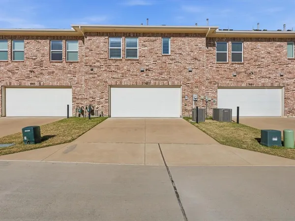 a front view of a house with yard