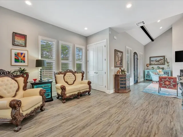 a living room with furniture and a table