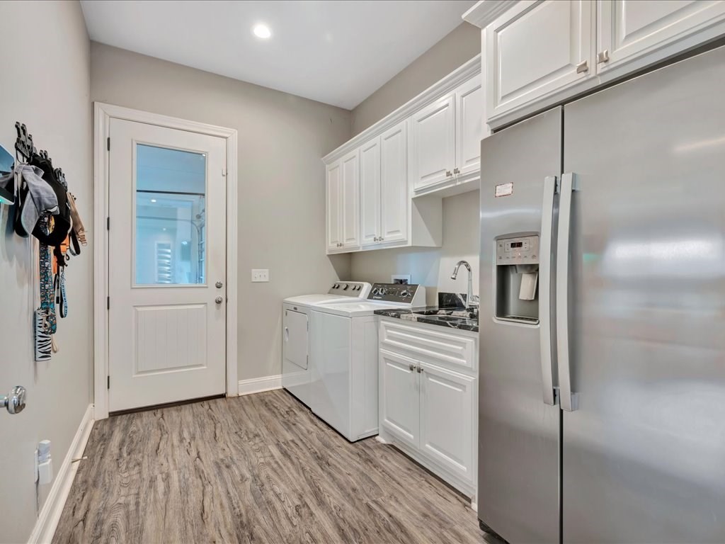 104 Wheeler Road Lufkin, TX 75901 - Photo 18 of 50 a kitchen with white cabinets and white appliances