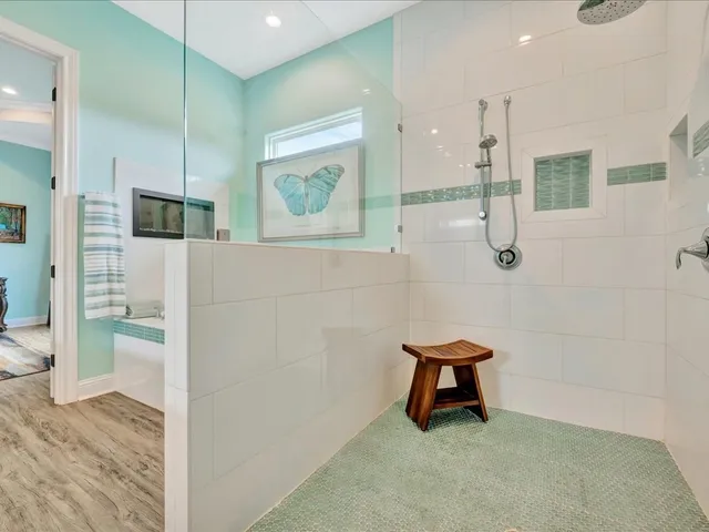 a bathroom with a shower and a sink