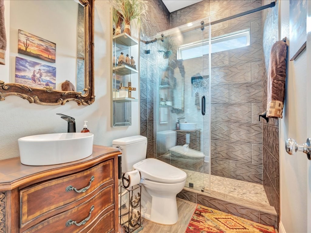 104 Wheeler Road Lufkin, TX 75901 - Photo 26 of 50 a bathroom with a sink toilet and shower