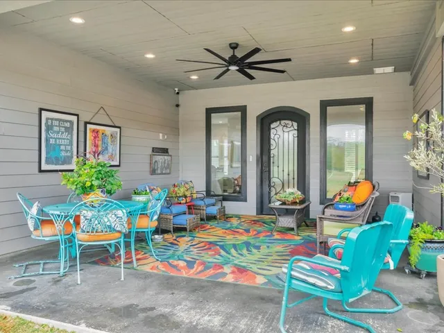 a room with lots of furniture and a chandelier