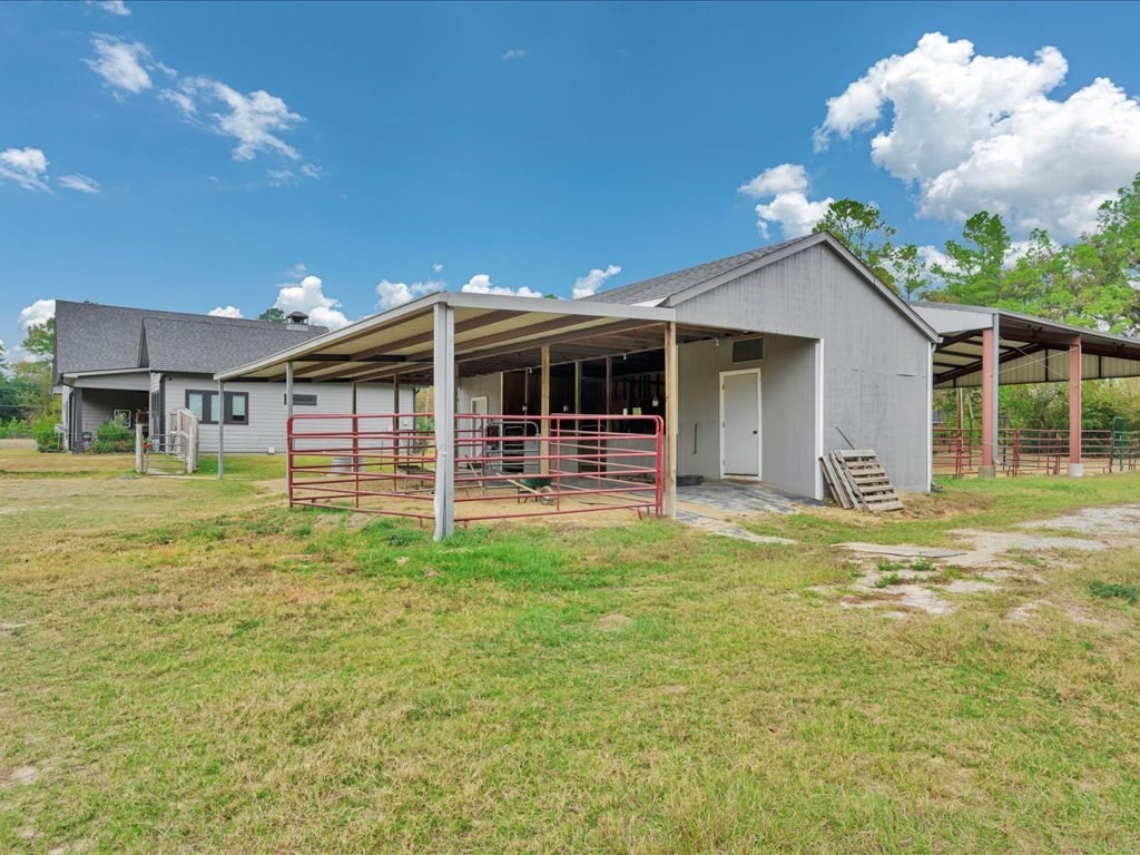 104 Wheeler Road Lufkin, TX 75901 - Photo 35 of 50 a view of a house with backyard porch and furniture