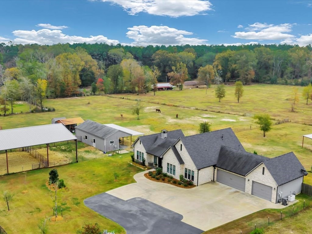104 Wheeler Road Lufkin, TX 75901 - Photo 45 of 50 a view of a swimming pool with a table and chairs