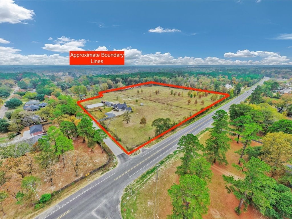 104 Wheeler Road Lufkin, TX 75901 - Photo 49 of 50 an aerial view of an ocean house a swimming pool and valleys in the background
