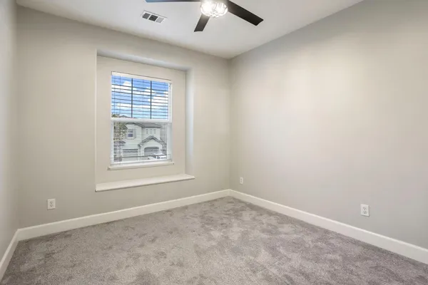 a view of an empty room and entryway