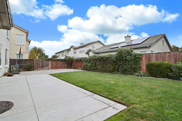 a front view of a house with a yard and porch
