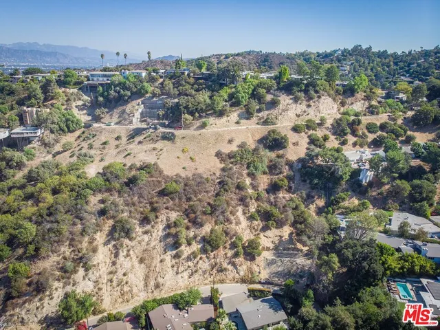 an aerial view of residential house and outdoor space