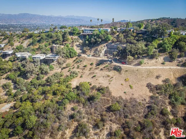 an aerial view of house with yard