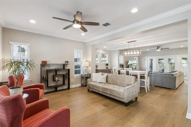 a living room with furniture fireplace and a window
