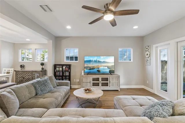 a bathroom with a double vanity sink mirror and shower