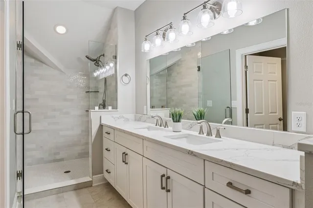 a bedroom with a bed couch and window