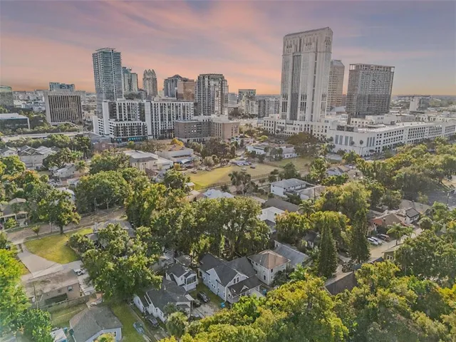 a view of a dining room with furniture wooden floor and chandelier