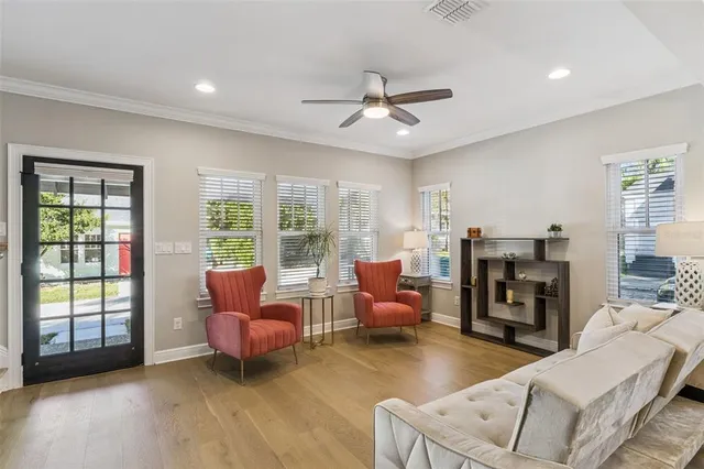 a living room with furniture and a large window