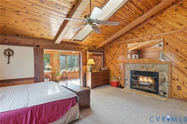 a bed room with a bed and a fireplace