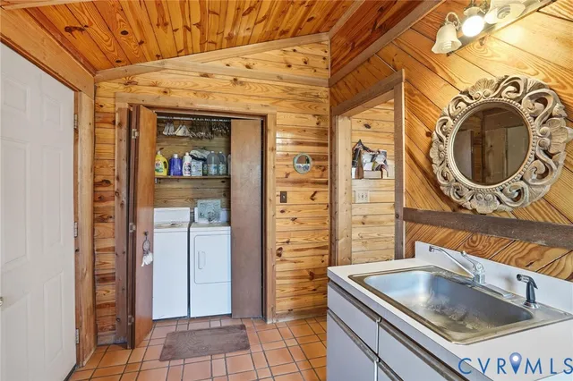 a kitchen with a sink and a refrigerator