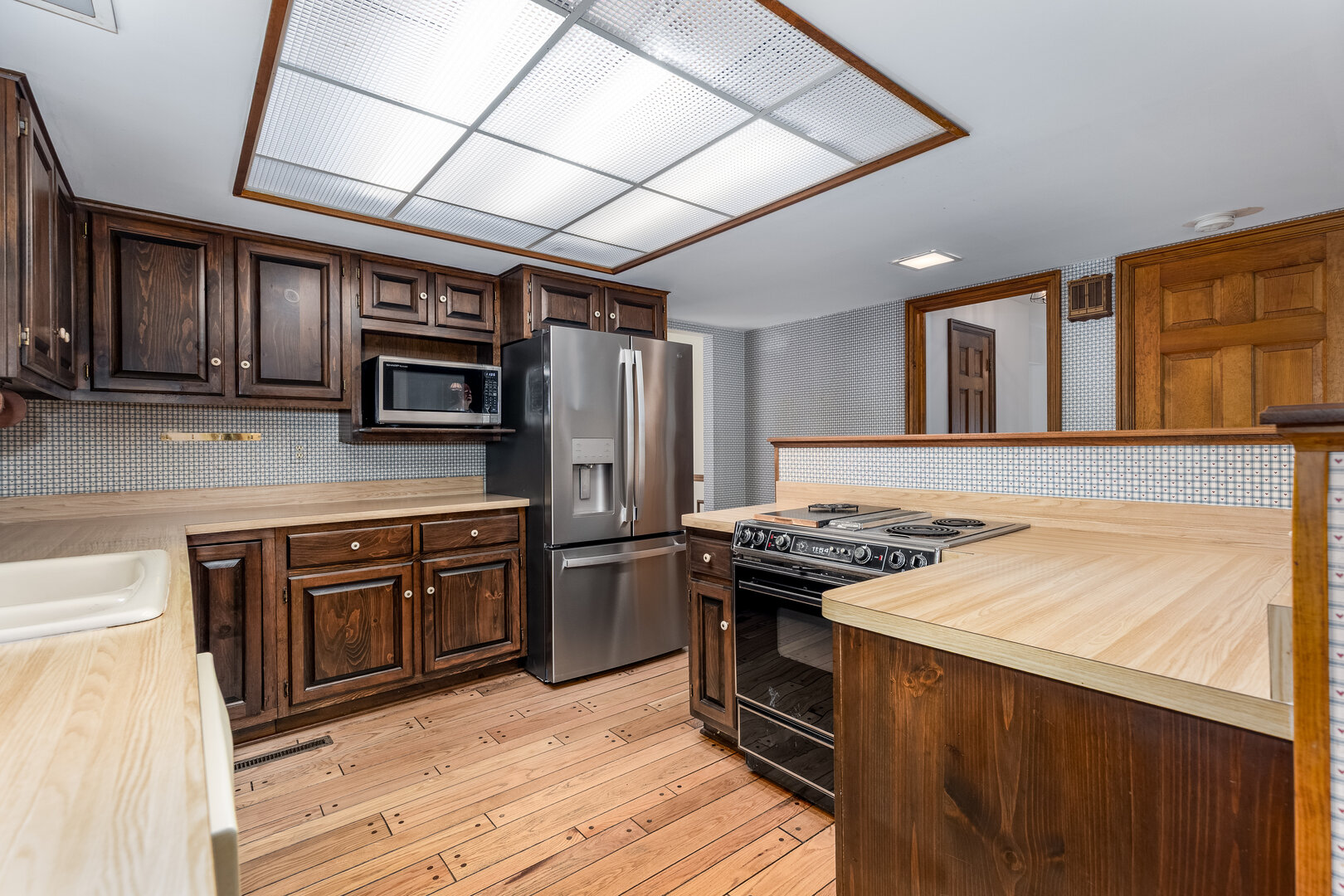 3094 East 1888th Road Ottawa, IL 61350 - Photo 14 of 43 a kitchen with stainless steel appliances granite countertop a stove and a sink