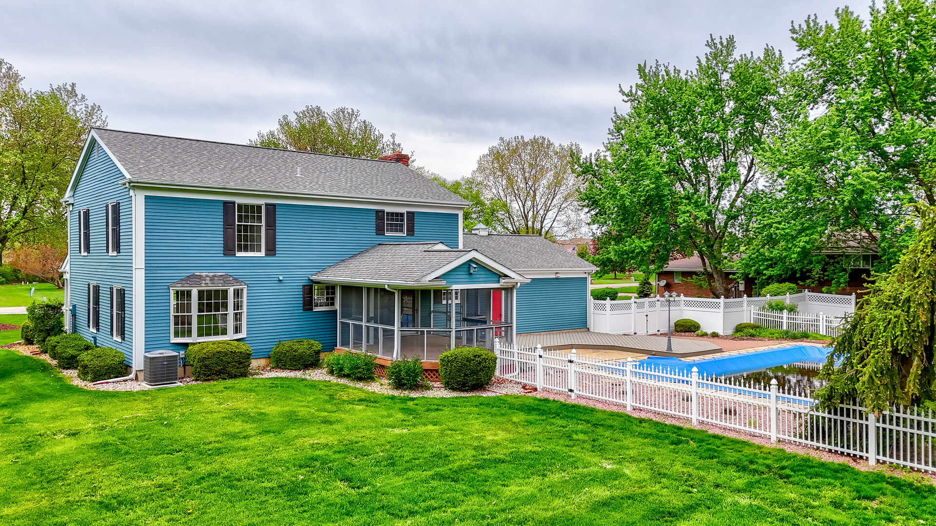 3094 East 1888th Road Ottawa, IL 61350 - Photo 32 of 43 a front view of a house with a yard table and chairs