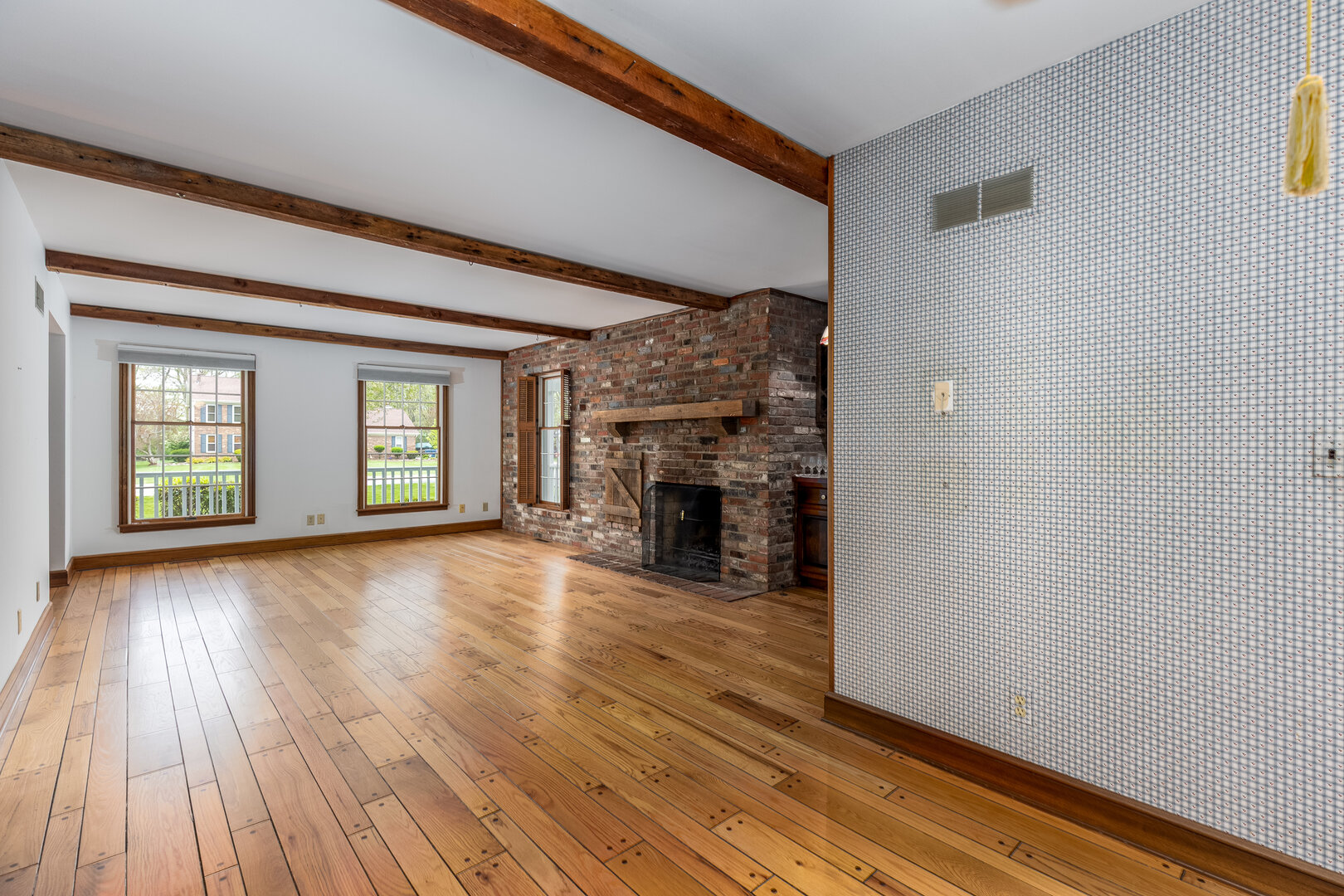 3094 East 1888th Road Ottawa, IL 61350 - Photo 7 of 43 a view of empty room with wooden floor and fireplace