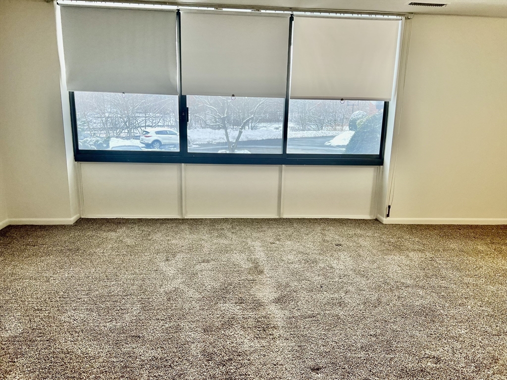 1004 Paradise Road, Unit 1L Swampscott, MA 01907 - Photo 15 of 28 a view of a room with a large window