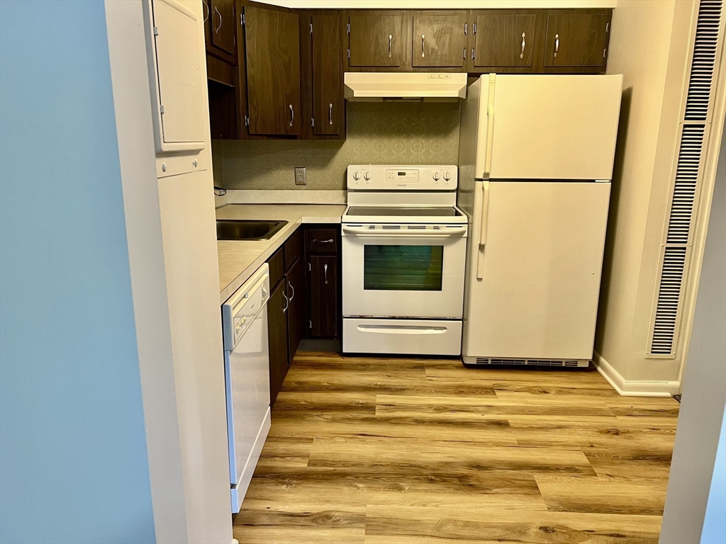 1004 Paradise Road, Unit 1L Swampscott, MA 01907 - Photo 18 of 28 a utility room with dryer and washer