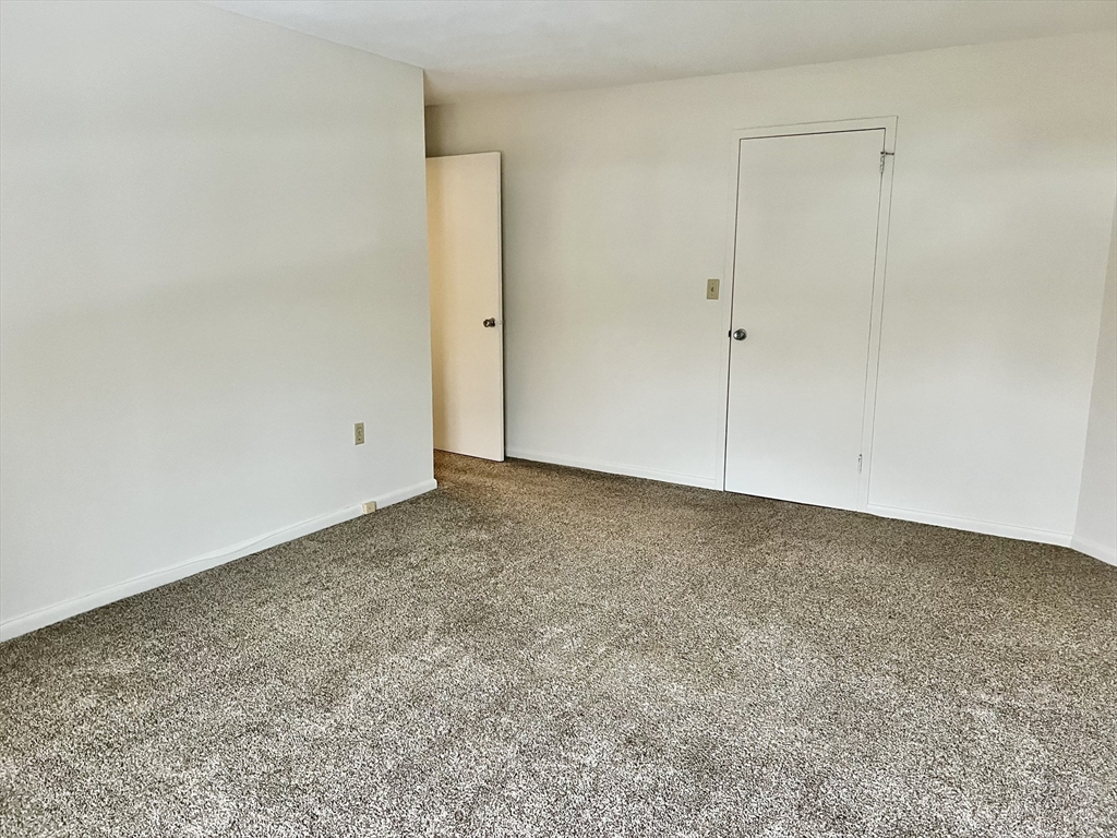 1004 Paradise Road, Unit 1L Swampscott, MA 01907 - Photo 23 of 28 a view of an empty room