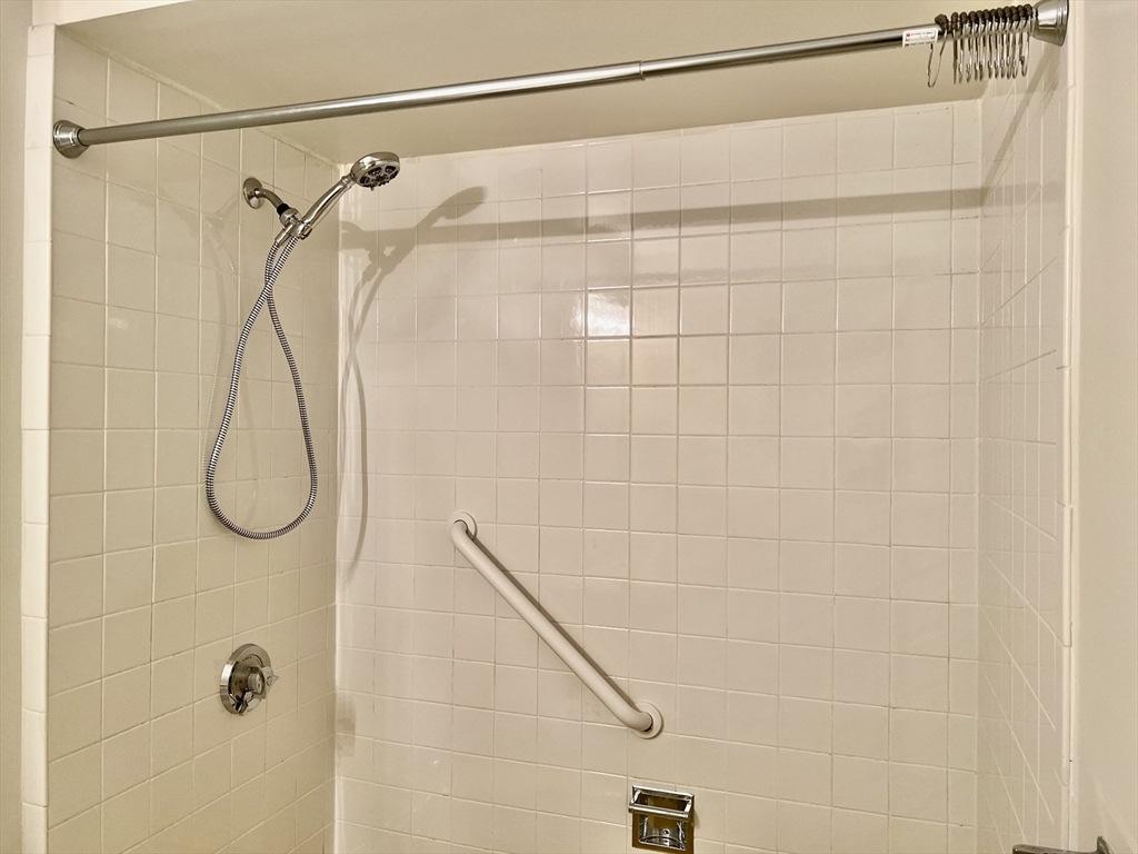 1004 Paradise Road, Unit 1L Swampscott, MA 01907 - Photo 27 of 28 a bathroom with a shower