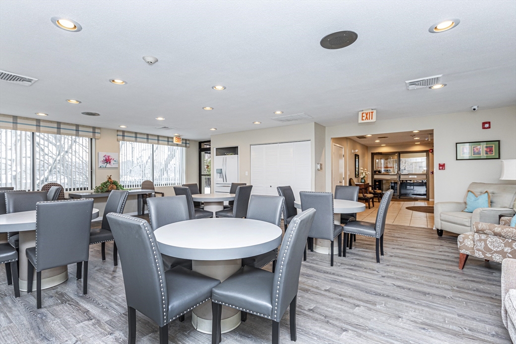 1004 Paradise Road, Unit 1L Swampscott, MA 01907 - Photo 5 of 28 a view of a dining room with furniture