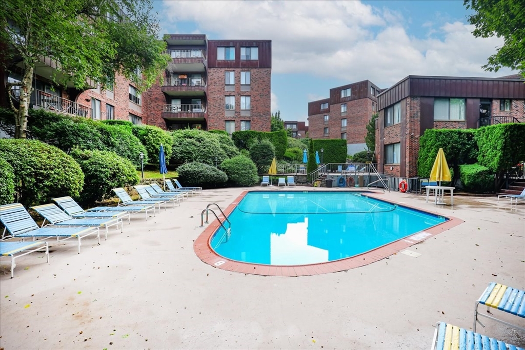 1004 Paradise Road, Unit 1L Swampscott, MA 01907 - Photo 8 of 28 a view of outdoor space yard and swimming pool