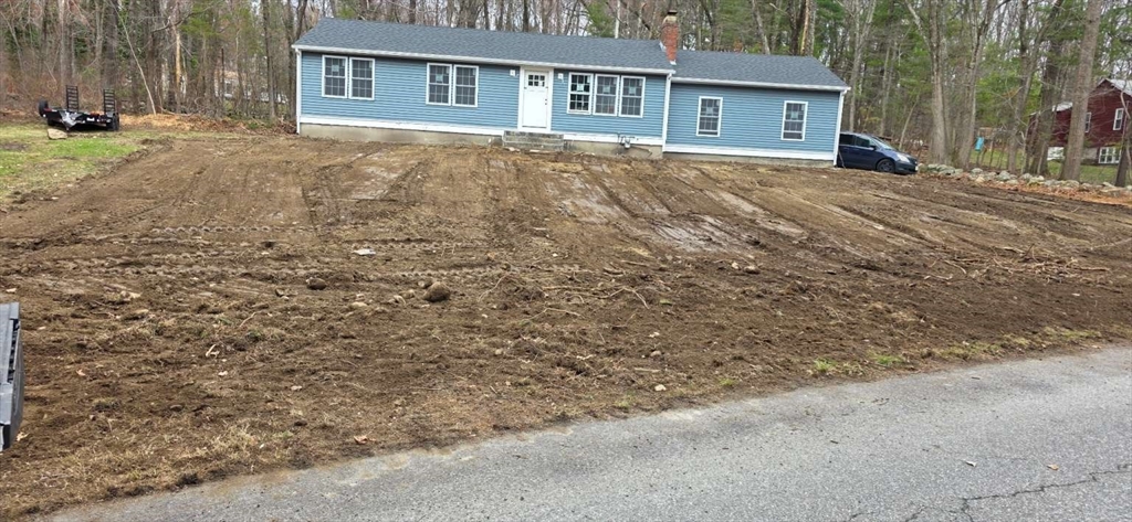 8 Galloway Road Chelmsford, MA 01824 - Photo 2 of 3 front view of a house with a yard