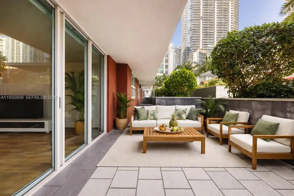 a outdoor space with patio furniture and potted plants