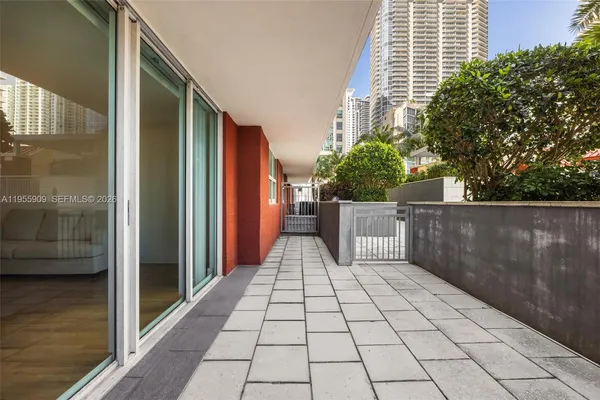 wooden floor pool table and chairs in a room