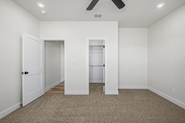 a view of a kitchen with microwave and cabinets