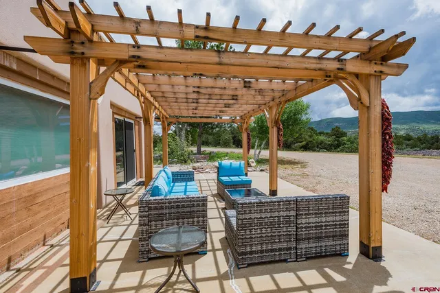 a view of a large building in middle of the green field