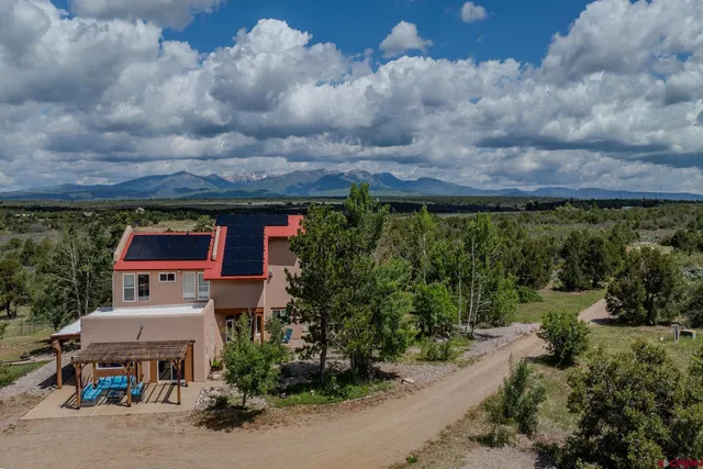 an aerial view of a house with garden